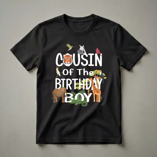 Black t-shirt with white text 'Cousin Of The Birthday Boy' surrounded by cartoon zoo animals including a tiger, zebra, giraffe, elephant, alligator, toucan, cockatoo, cardinal, and hummingbird.