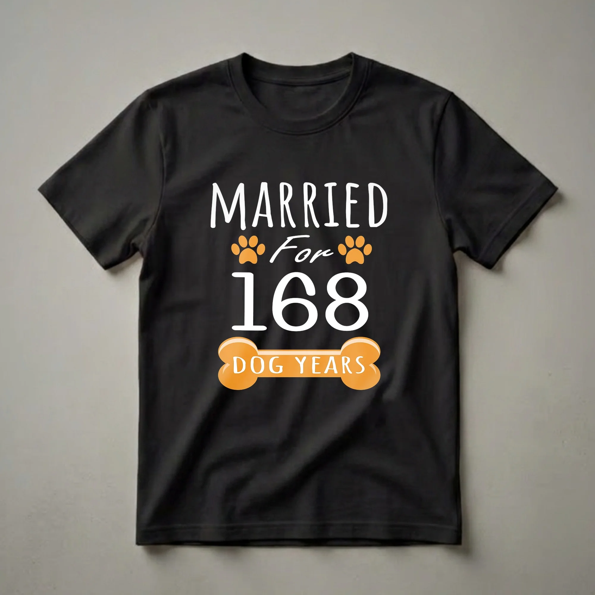 Black t-shirt with white text reading 'MARRIED For 168 DOG YEARS' and orange paw prints and a dog bone graphic.