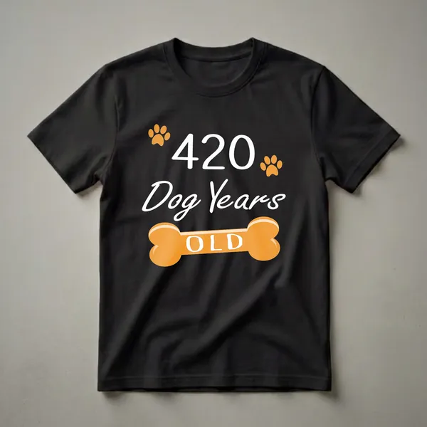 Black t-shirt with white text reading '420 Dog Years Old' and an orange dog bone graphic with paw prints, celebrating a 60th birthday.