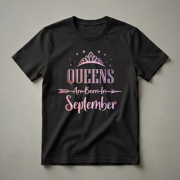 Black t-shirt with pink and purple watercolor text that reads 'QUEENS Are Born In September', topped with a crown and surrounded by stars.