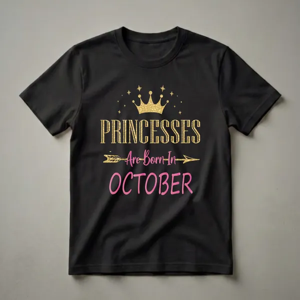 Black t-shirt with gold and pink text that reads 'PRINCESSES Are Born In OCTOBER', topped with a golden crown and stars.