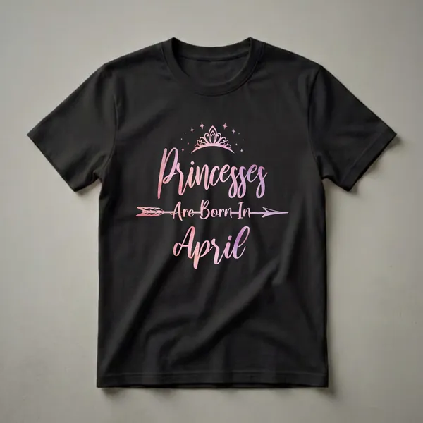 Black t-shirt with a watercolor graphic that reads 'Princesses Are Born In April', featuring a tiara, stars, and an arrow.