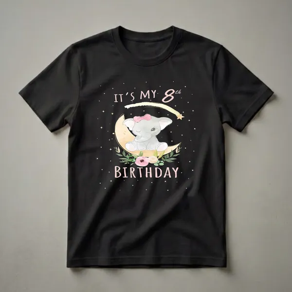 Black t-shirt featuring a watercolor illustration of a gray baby elephant with a pink bow, sitting on a yellow crescent moon, surrounded by pink flowers, green leaves, and yellow stars, with text 'IT'S MY 8th BIRTHDAY'.