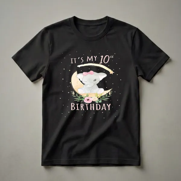 Black t-shirt with a watercolor illustration of a baby elephant wearing a pink bow, sitting on a crescent moon surrounded by flowers, leaves, stars, and the text 'IT'S MY 10th BIRTHDAY'.