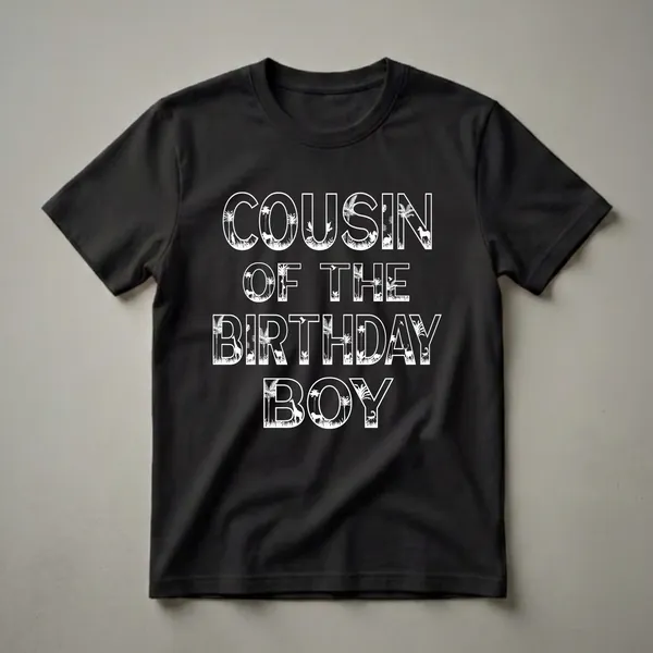 Black t-shirt with white text that reads 'COUSIN OF THE BIRTHDAY BOY', with each letter filled with silhouettes of various jungle and savanna animals and tropical plants.