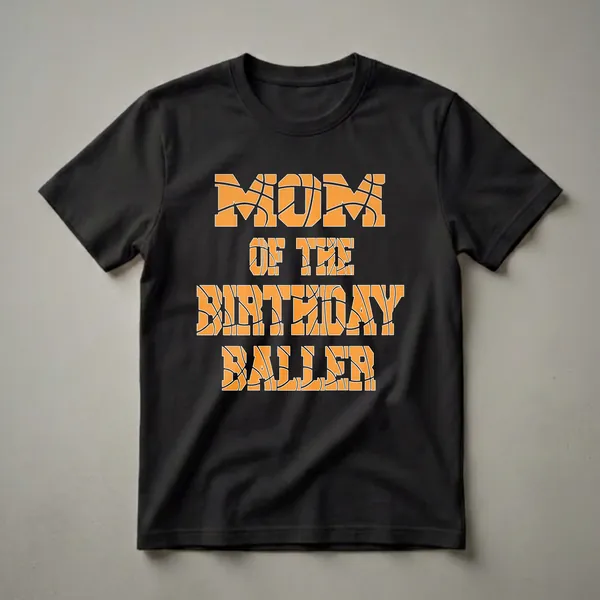 Black t-shirt with orange block letters that read 'MOM OF THE BIRTHDAY BALLER' filled with a basketball texture.