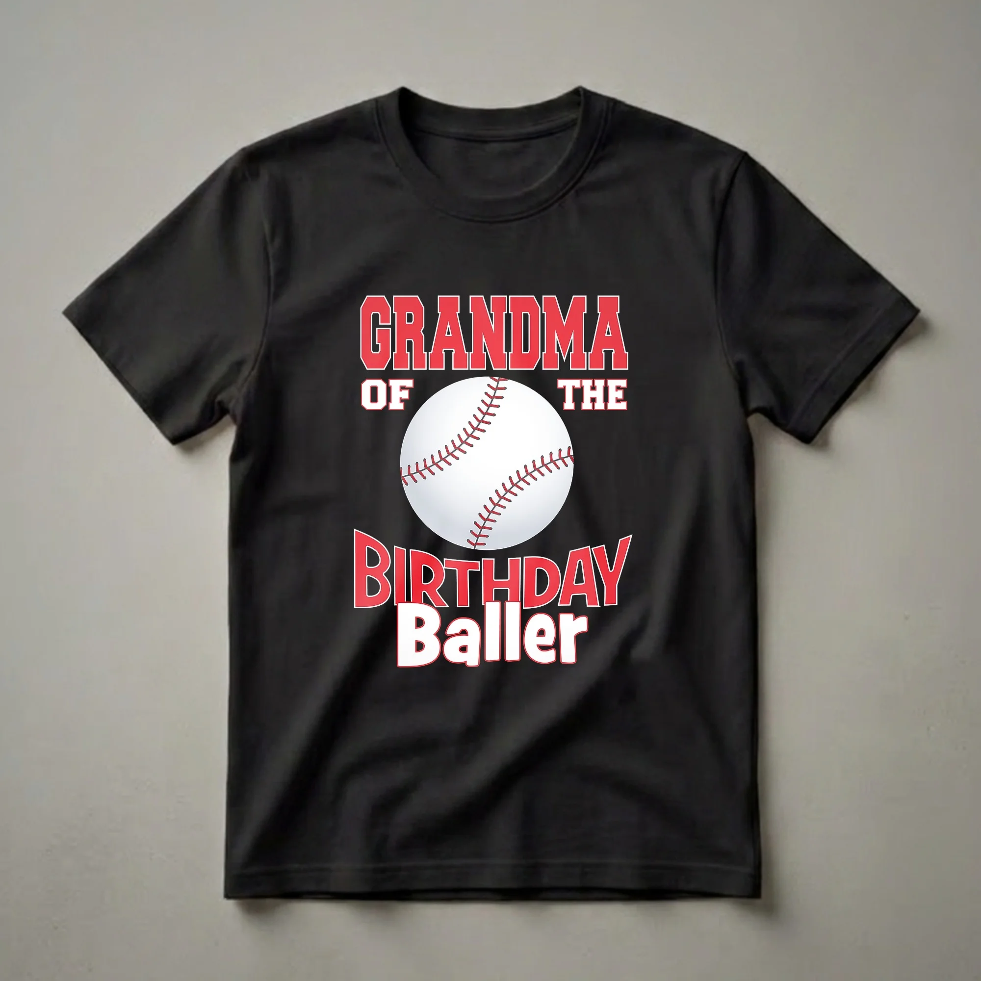 Black t-shirt with red and white text reading 'GRANDMA OF THE BIRTHDAY Baller' and a graphic of a baseball.