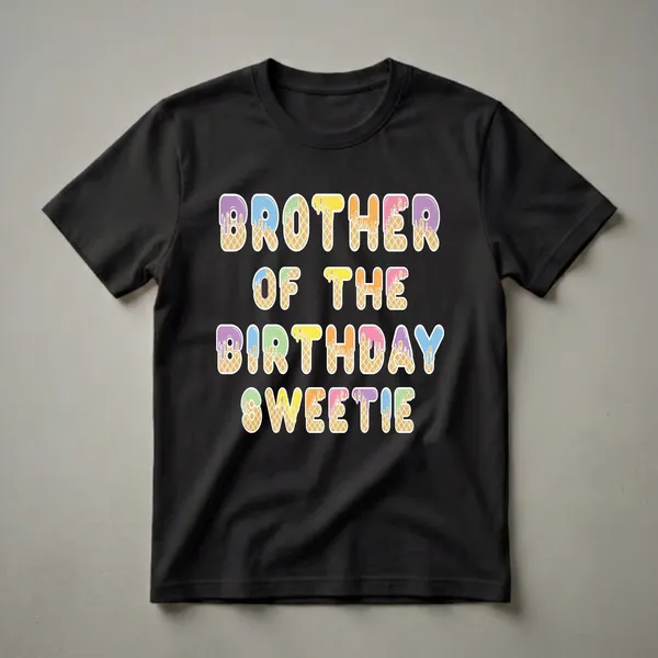 White t-shirt with "BROTHER OF THE BIRTHDAY SWEETIE" printed in colorful, ice cream cone-shaped letters with dripping frosting.