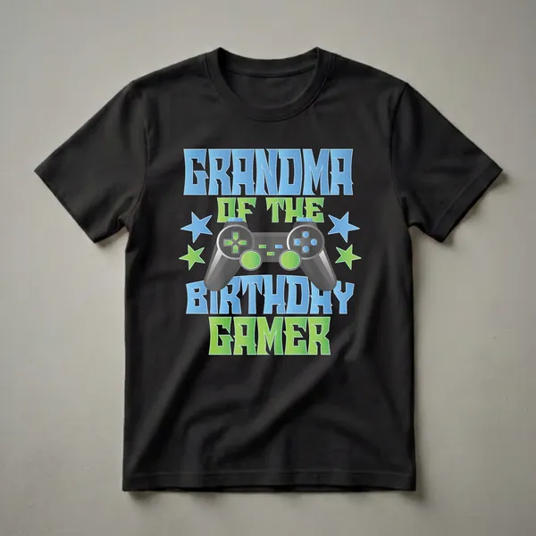 Black t-shirt with blue and green gradient text reading 'GRANDMA OF THE BIRTHDAY GAMER' and a realistic video game controller graphic with blue and green stars.