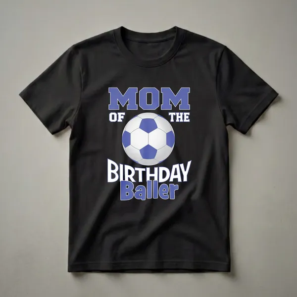 Black t-shirt with blue and white text reading 'MOM OF THE BIRTHDAY Baller' and a graphic of a blue and white soccer ball.
