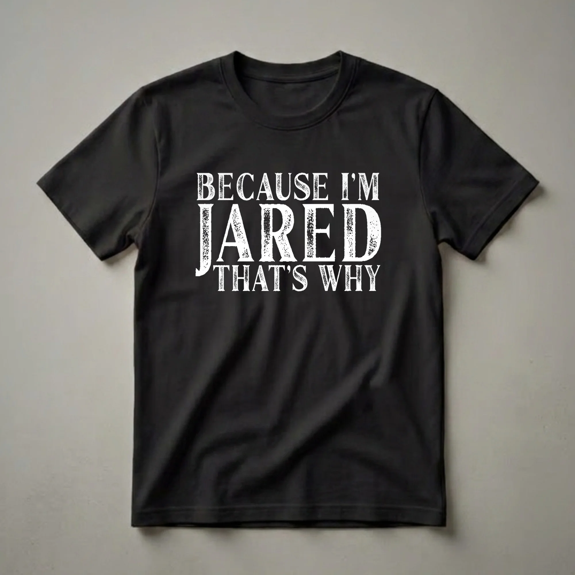 Black t-shirt with distressed white text that reads 'BECAUSE I'M JARED THAT'S WHY'.