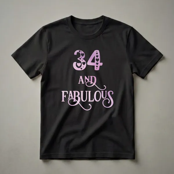 Black t-shirt with pink watercolor gradient graphic that reads '34 AND FABULOUS', featuring hearts and dots.