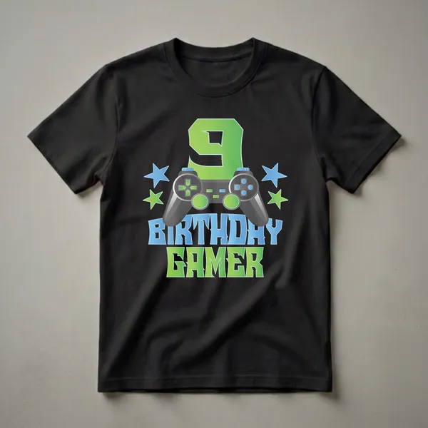 Black t-shirt with a graphic design featuring a large green number 9, a video game controller, blue and green stars, and the words BIRTHDAY GAMER.
