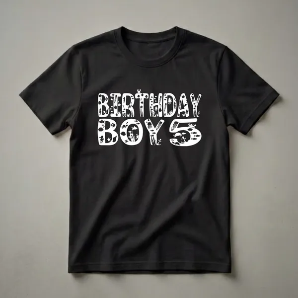 White graphic text on a black shirt that reads 'BIRTHDAY BOY 5', with the letters filled with various sea creatures like fish, jellyfish, turtles, crabs, and seahorses.