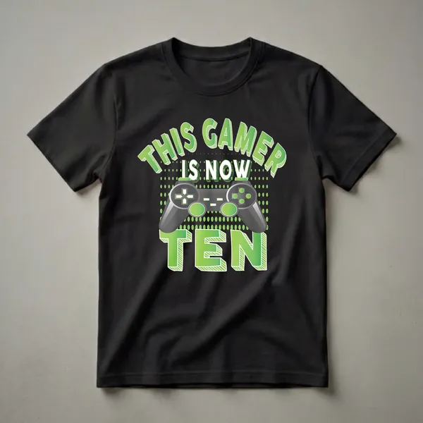 Black t-shirt with green and white text that reads 'THIS GAMER IS NOW TEN' and a graphic of a video game controller.