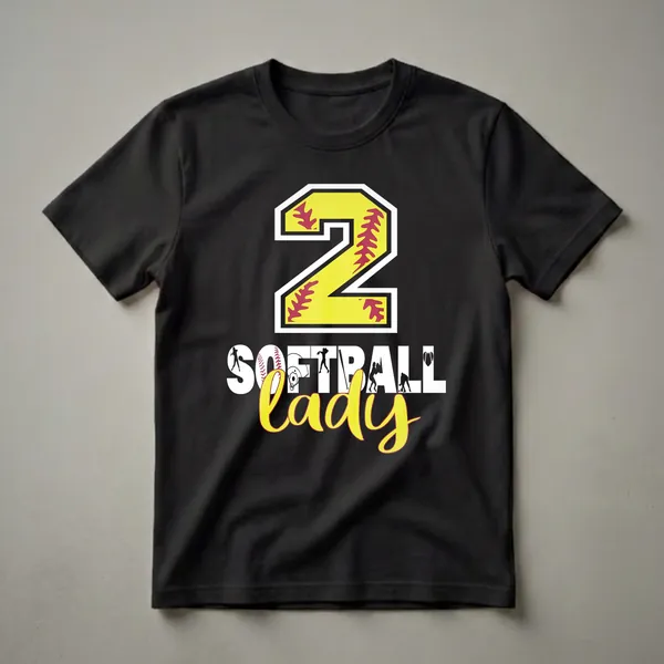 Black t-shirt with a large yellow number '2' filled with red softball stitching, and the words 'SOFTBALL lady' below, incorporating softball player silhouettes, a helmet, and a baseball heart.