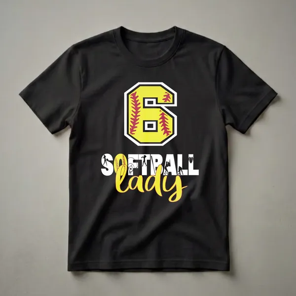 Black t-shirt featuring a large yellow number 6 with red softball stitching, and the words SOFTBALL LADY in white with integrated silhouettes of softball players, a helmet, and a baseball field.