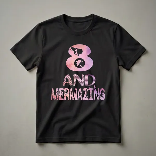 Black graphic t-shirt with pink and purple watercolor design featuring the number 8 and the text 'AND MERMAZING', adorned with mermaid silhouettes, starfish, and fish scales.