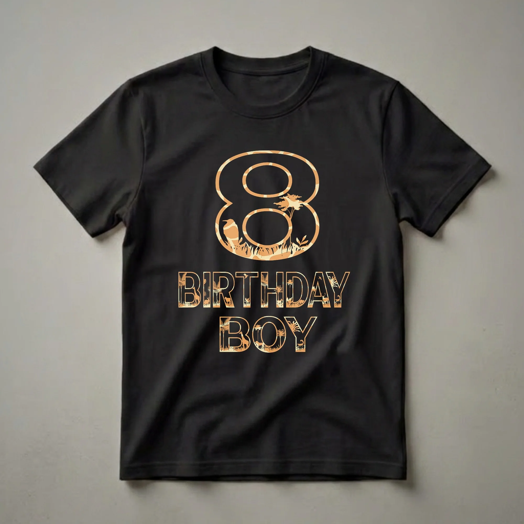 Black t-shirt with an orange and tan graphic design featuring the number 8 and the words "BIRTHDAY BOY" filled with safari animals, trees, and grass.