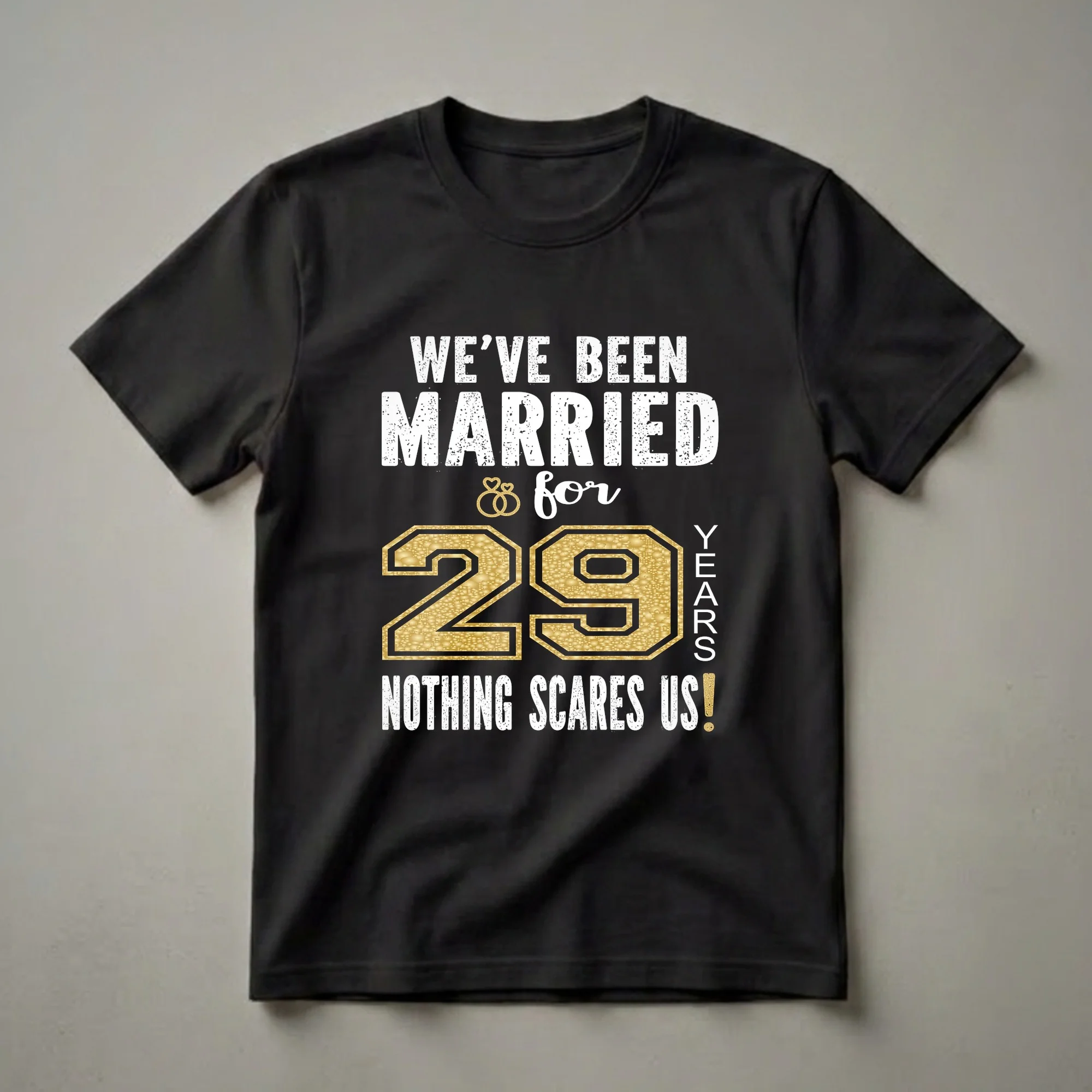 Black t-shirt with white distressed text reading 'WE'VE BEEN MARRIED & for 29 YEARS NOTHING SCARES US!' and a large gold number '29' with wedding rings.