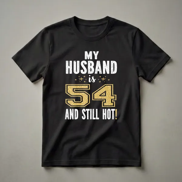 Black t-shirt with white distressed text 'MY HUSBAND IS 54 AND STILL HOT!' and a large gold glitter textured number 54.