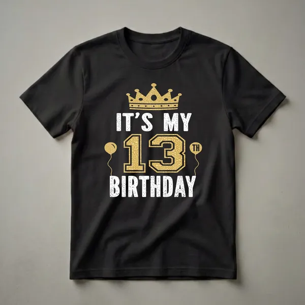 Black t-shirt with a gold crown, gold balloons, and distressed white and gold text that reads 'IT'S MY 13TH BIRTHDAY'.