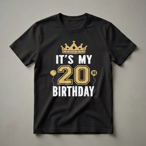 Black t-shirt with a gold crown, the number 20 in gold with a textured fill, two gold balloons, and white distressed text reading 'IT'S MY 20TH BIRTHDAY'.