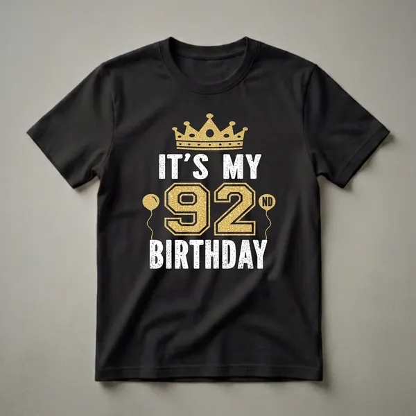 Black t-shirt with white and gold graphic text that reads 'IT'S MY 92ND BIRTHDAY' with a gold crown and gold balloons.