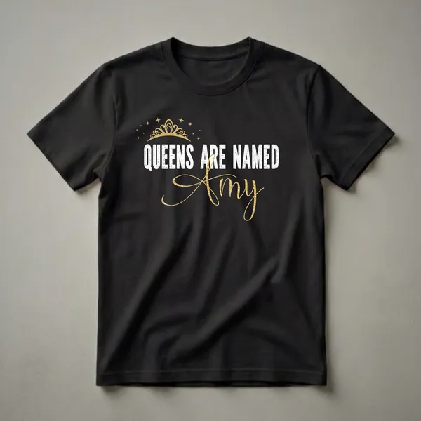 Black t-shirt with white distressed text 'QUEENS ARE NAMED' and a gold script name 'Amy', topped with a gold crown and scattered gold stars.