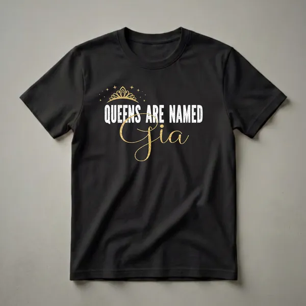 Black t-shirt with white distressed text 'QUEENS ARE NAMED' and a gold glitter script name 'Gia', accented by a gold crown and stars.