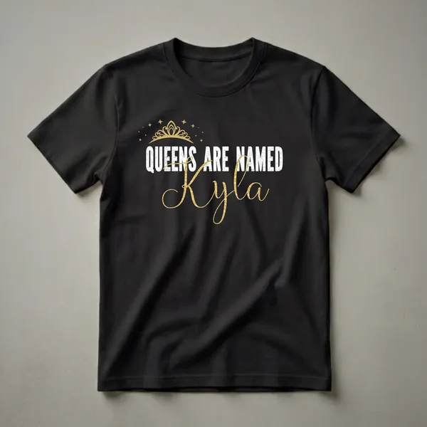 Black graphic t-shirt with a gold crown and stars above distressed white text reading 'QUEENS ARE NAMED' and a flowing gold script name 'Kyla'.