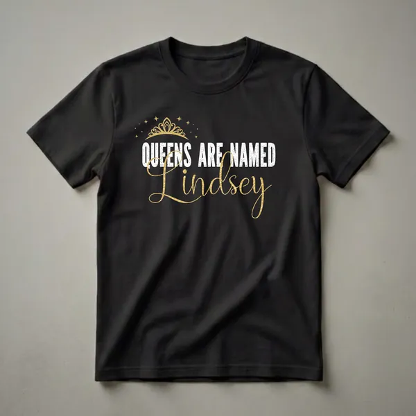 Black t-shirt with white distressed text 'QUEENS ARE NAMED' and gold script text 'Lindsey', topped with a gold crown and stars.