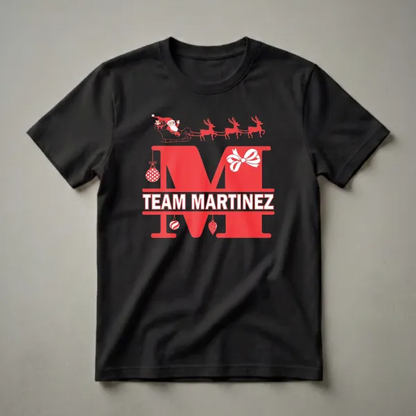 Black t-shirt featuring a large red split letter 'M' with 'TEAM MARTINEZ' in white text, adorned with Christmas ornaments and Santa in a sleigh with reindeer above.