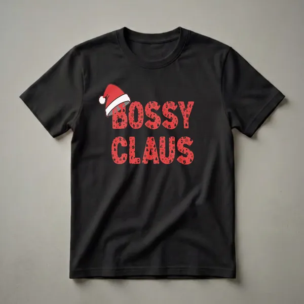 Red graphic t-shirt with black text that reads 'BOSS CLAUS', filled with Christmas icons like snowflakes, gingerbread men, and Santa hats, topped with a Santa hat.