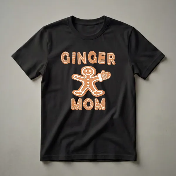 Black t-shirt featuring a gingerbread person graphic with the words GINGER MOM in gingerbread lettering, designed for Christmas.