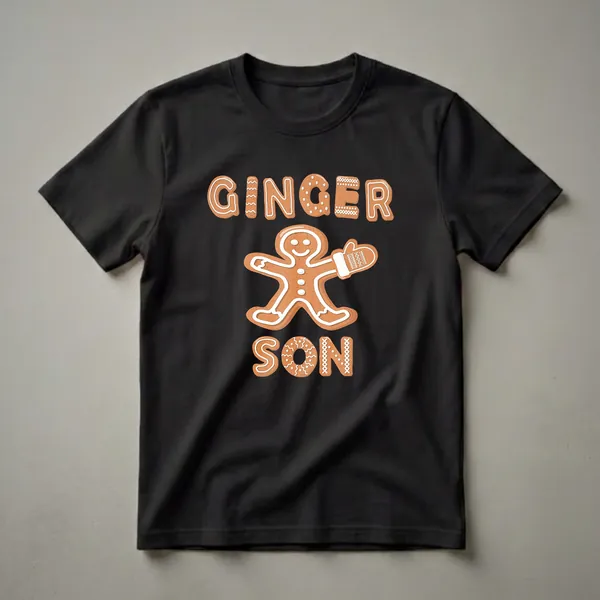 Black t-shirt with a "Ginger Son" gingerbread man graphic. The text and gingerbread man are designed to look like frosted cookies with white icing details.