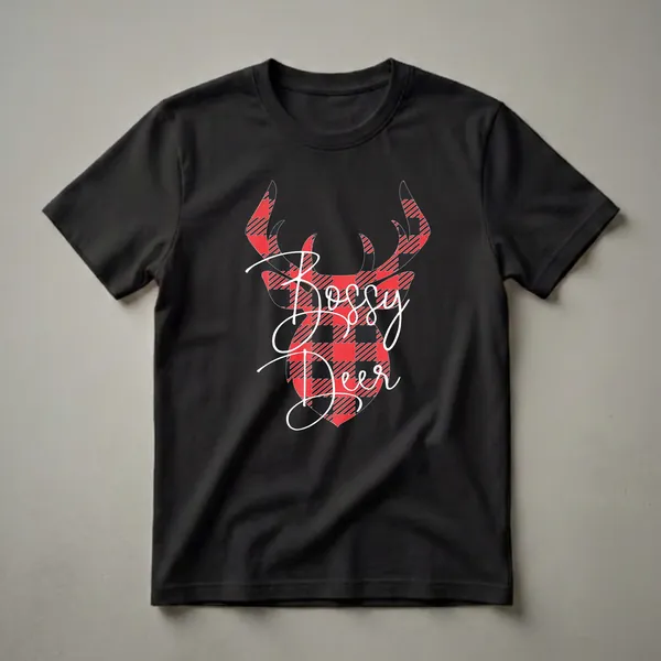 Black t-shirt with a red and black buffalo plaid deer head graphic and white cursive text that reads 'Bossy Deer'.