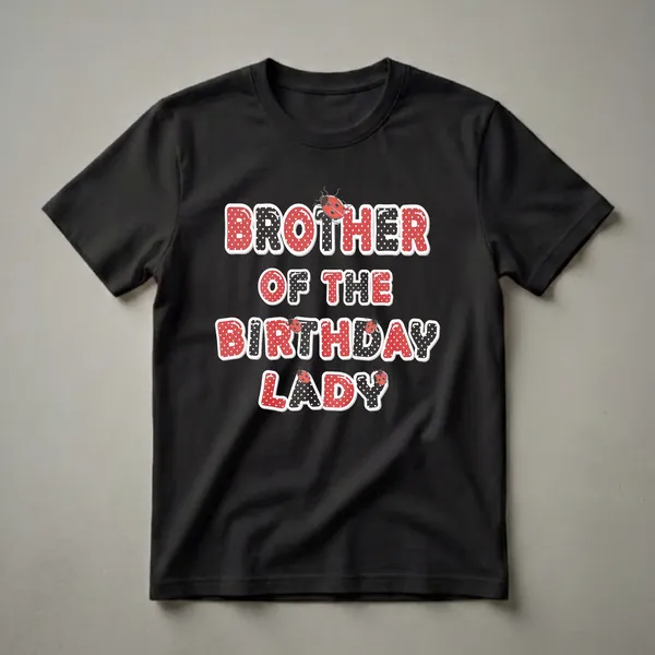 Black t-shirt with red and black polka dot text that reads 'BROTHER OF THE BIRTHDAY LADY', adorned with cartoon ladybugs.