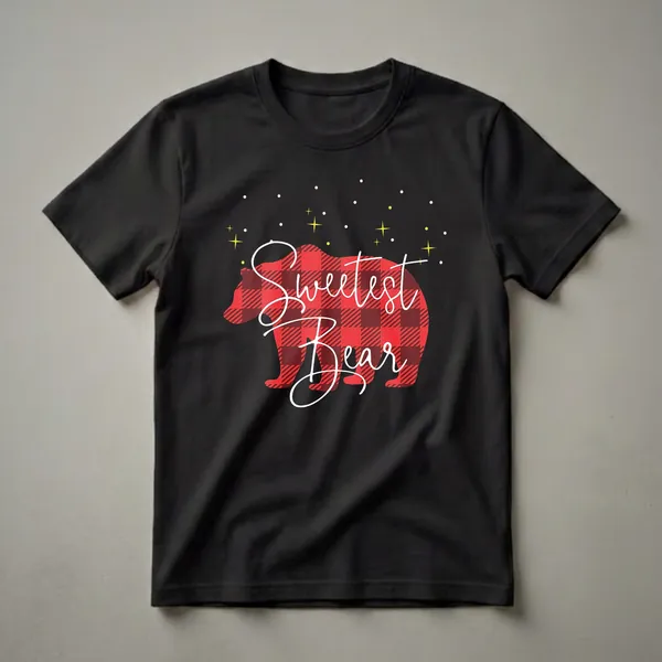 Black t-shirt with a red and black buffalo plaid bear silhouette filled with white cursive text that reads 'Sweetest Bear', against a black background with yellow stars and white dots.