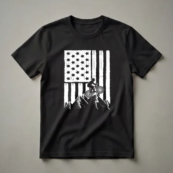 Black t-shirt with a distressed white American flag graphic overlaying a silhouette of a mountain biker jumping over rocky peaks.