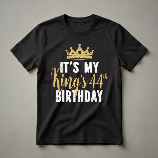 Black t-shirt with a gold glitter crown above distressed white text 'IT'S MY BIRTHDAY' and gold glitter text 'King's 44th'.