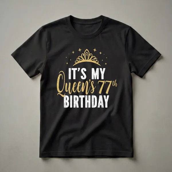 Black t-shirt with white and gold text that reads 'IT'S MY QUEEN'S 77th BIRTHDAY' with a golden crown and stars graphic.