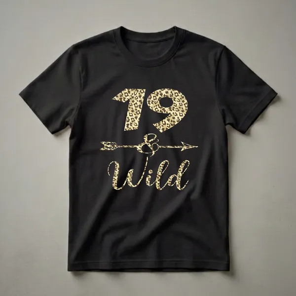Black t-shirt with "19 and Wild" text and an arrow graphic, all in a leopard print pattern. The number 19 is at the top, followed by an ampersand with an arrow through it, and the word Wild at the bottom.