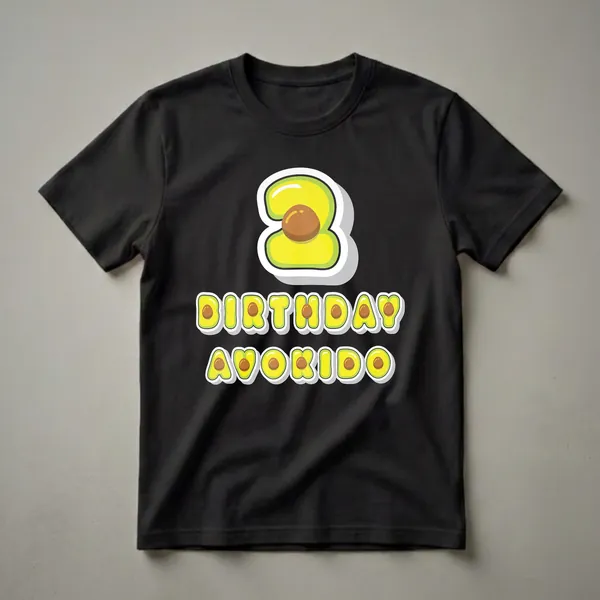 A graphic t-shirt design featuring the number 3 shaped like a sliced avocado with the text "BIRTHDAY AVOKIDO" below it, all in a cartoon style.