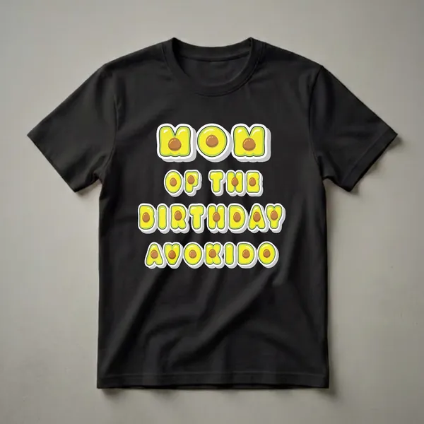 Black t-shirt with the text 'MOM OF THE BIRTHDAY AVOKIDO BOYS AND GIRLS' in letters designed to look like avocado slices with pits.