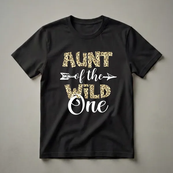 Black t-shirt with the words "AUNT" and "WILD" in leopard print letters, "of the" in white script, and "One" in large white script, with a white arrow graphic.
