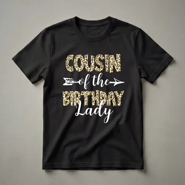 Black t-shirt with the text "Cousin of the Birthday Lady" in leopard print and white script, with a white arrow graphic.