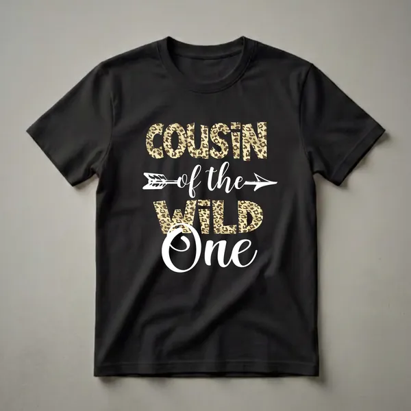 Black t-shirt with white text 'Cousin of the Wild One' and a white arrow, with 'COUSIN' and 'WILD ONE' filled with a leopard print pattern.