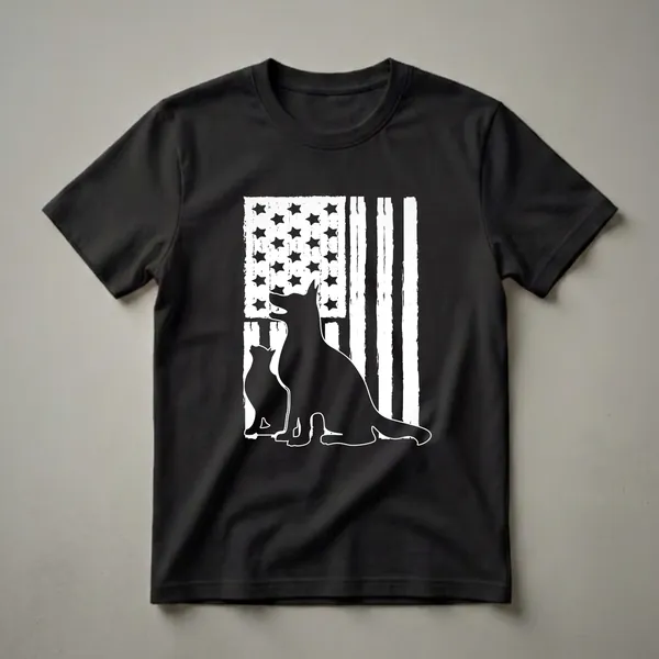 A black graphic t-shirt featuring the silhouette of a German Shepherd and a cat sitting in front of a distressed white and black American flag.