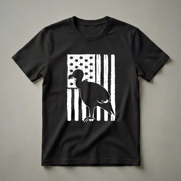 Black silhouette of a vulture standing in front of a distressed white and black American flag, on a black t-shirt.